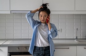 Concerned woman talking on phone