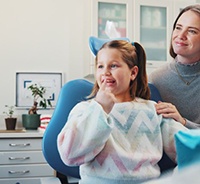 Child dental patient interacting with dentist