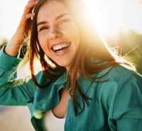 Smiling young woman during golden hour