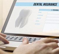 Dental insurance form displayed on laptop screen