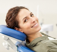 Happy patient reclining in chair after treatment by emergency dentist in Auburn