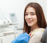 Smiling dental patient attending appointment for preventive checkup