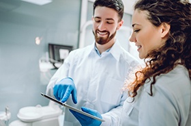 Dentist and patient discussing need for tooth-colored fillings