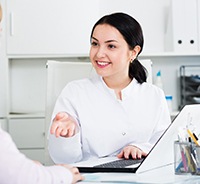 Patient and dental team member discussing payment options