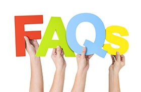 Colorful FAQ for dental implants sign against white background
