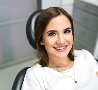 Female dental patient relaxing before implant placement surgery