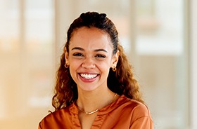 Portrait of young woman with confident smile
