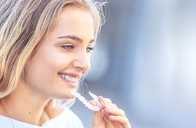 happy woman with Invisalign