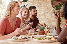 Group of friends eating a meal together