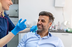 Invisalign patient talking with dental team member