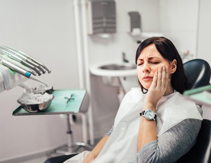 Woman in pain at the dentist
