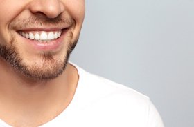Man enjoying healthy smile thanks to root canal therapy