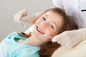 smiling girl at dentist