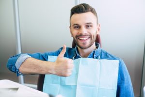 Man at appointment to maximize dental insurance benefits