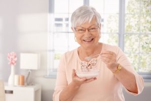 Senior woman enjoying a snack