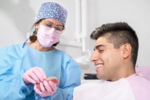 Invisalign patient talking with dentist